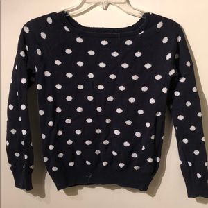 Dark blue and white Polkadotted kids sweater.